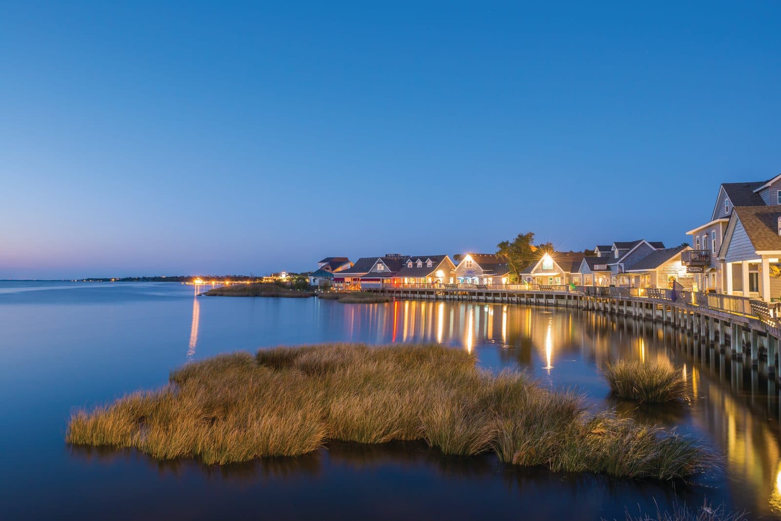 Duck, North Carolina waterfront shops at dusk