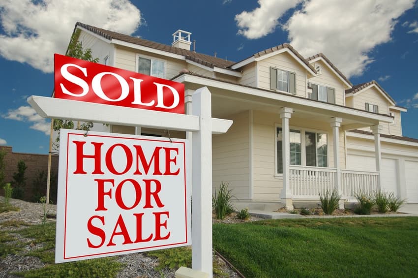 Sold sign in front of an Outer Banks home