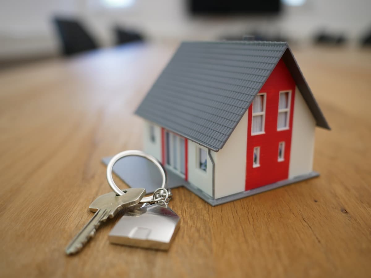 Real estate agent reviewing mortgage paperwork with buyers
